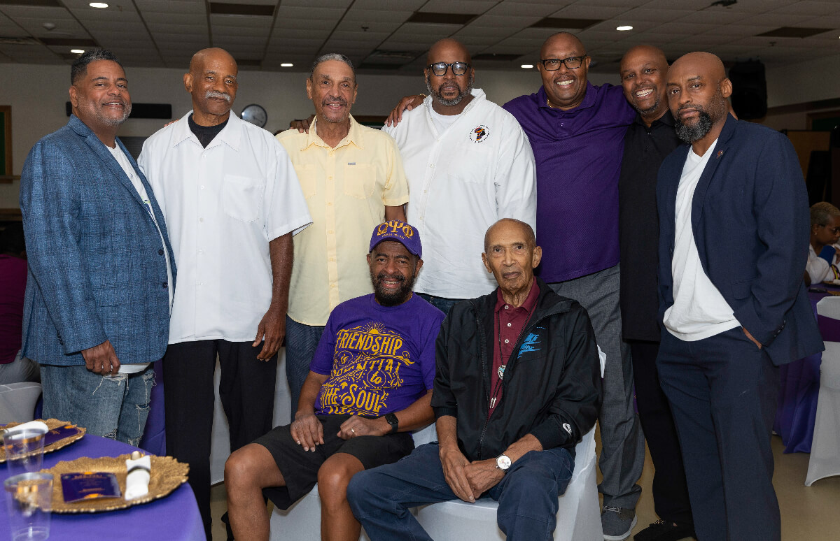 group of men posing for photo