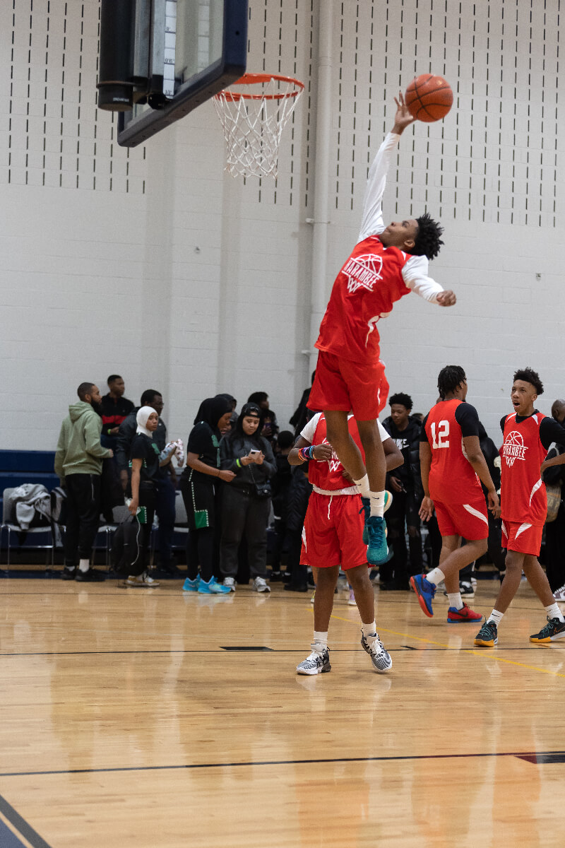 basketball player going up for a dunk