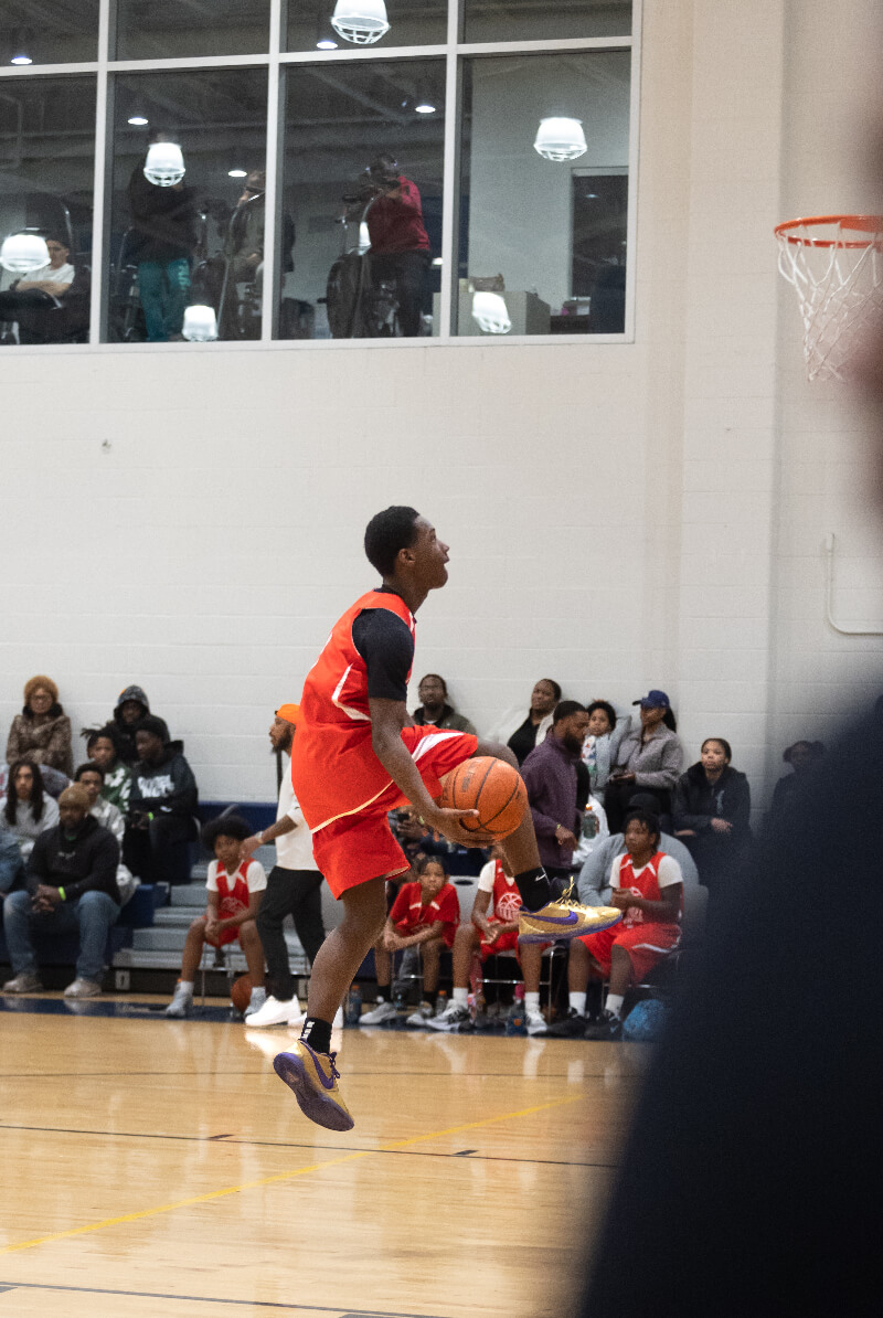 basketball player passing ball under leg